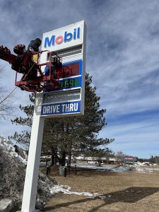 NH Signs - petroleum gas station sign being serviced